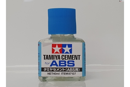 Tamiya cement for ABS plastics.